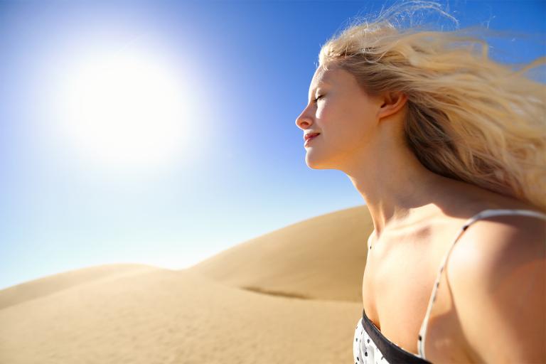 A woman in the desert heat, with beautiful youthful skin