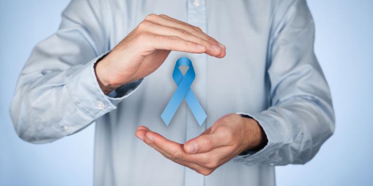 man holding prostate cancer awareness ribbon